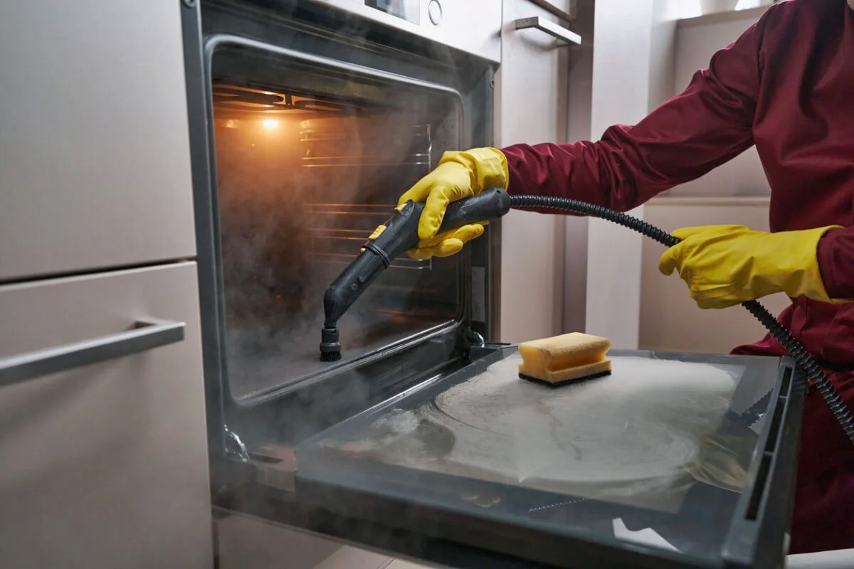 Oven cleaning professionals at work